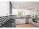 Modern kitchen featuring sleek black countertops and stainless steel appliances at 3200 Lowndes St, East Point, GA 30344