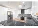 Bright kitchen with marbled countertops, stainless appliances and contemporary lighting at 3200 Lowndes St, East Point, GA 30344