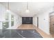 Bright living room with modern lighting, fireplace, and floating shelves at 3200 Lowndes St, East Point, GA 30344