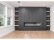 Contemporary living room with fireplace, wooden shelving and a feature wall, offering a cozy atmosphere at 3200 Lowndes St, East Point, GA 30344