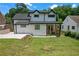 Exterior view of home featuring a large backyard and deck at 656 S Elizabeth Nw Pl, Atlanta, GA 30318