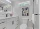 Modern bathroom featuring sleek fixtures, quartz countertops, a white vanity, and a glass enclosed shower at 656 S Elizabeth Nw Pl, Atlanta, GA 30318