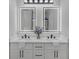 Beautiful bathroom featuring dual vanity sinks and lighted mirrors at 656 S Elizabeth Nw Pl, Atlanta, GA 30318