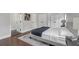 Modern bedroom featuring a gray color scheme, a large bed, and plenty of natural light at 656 S Elizabeth Nw Pl, Atlanta, GA 30318