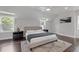 Cozy bedroom under angled ceiling features neutral decor and ample natural light at 656 S Elizabeth Nw Pl, Atlanta, GA 30318