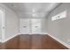 Spacious bedroom with gleaming hardwood floors and two large closet doors at 656 S Elizabeth Nw Pl, Atlanta, GA 30318