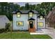 Charming two-story home with white siding, black trim, dormer windows and well-manicured yard at 656 S Elizabeth Nw Pl, Atlanta, GA 30318