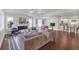 Bright and airy living room featuring a fireplace, hardwood floors, and an open layout to the dining and kitchen areas at 656 S Elizabeth Nw Pl, Atlanta, GA 30318