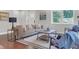 Well-lit living room with hardwood floors, modern furnishings, and a comfortable seating arrangement at 656 S Elizabeth Nw Pl, Atlanta, GA 30318
