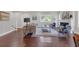 Spacious living room showcasing hardwood floors, plenty of natural light, and a cozy seating area with stylish decor at 656 S Elizabeth Nw Pl, Atlanta, GA 30318