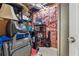 Unfinished storage area in basement with exposed ceiling, insulation and shelving units at 672 Victorian Cir, Dallas, GA 30157