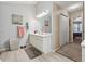 Bathroom features a spacious vanity with ample counter space and a view of the nearby bedroom at 672 Victorian Cir, Dallas, GA 30157