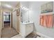 Bathroom features a spacious vanity with ample counter space and views to the neighboring bedroom at 672 Victorian Cir, Dallas, GA 30157