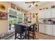 Inviting breakfast nook with a large window, modern table set, and decor giving a homey feel at 672 Victorian Cir, Dallas, GA 30157