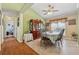 Dining room features tile flooring, a large window with natural light, and a classic dining set at 672 Victorian Cir, Dallas, GA 30157