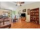 Spacious living room features hardwood floors, vaulted ceiling, built-in shelving, and decorative elements at 672 Victorian Cir, Dallas, GA 30157