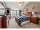 Relaxing primary bedroom with large windows, a decorative ceiling fan, and carpeted floors at 672 Victorian Cir, Dallas, GA 30157