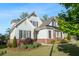 Charming two-story home with brick accents, gray siding, and meticulously manicured landscaping at 2208 Sage Mountain Sw Ct, Marietta, GA 30064