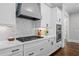 Elegant kitchen featuring quartz countertops, stainless appliances, and designer backsplash at 2208 Sage Mountain Sw Ct, Marietta, GA 30064