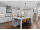 Stylish kitchen showcasing a spacious island, modern fixtures, and hardwood flooring at 2208 Sage Mountain Sw Ct, Marietta, GA 30064