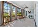 Relaxing sunroom with large windows, comfortable seating, and a ceiling fan at 2208 Sage Mountain Sw Ct, Marietta, GA 30064
