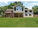 Two-story home with walkout basement and sprawling green lawn at 230 Thistlewood Ln, Roswell, GA 30075