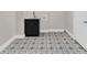 Bathroom with dark cabinets and a tiled floor at 230 Thistlewood Ln, Roswell, GA 30075