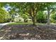 Charming single-story home with a well-maintained lawn at 230 Thistlewood Ln, Roswell, GA 30075