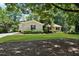 Charming single-story home with well-maintained landscaping and a lush front yard at 230 Thistlewood Ln, Roswell, GA 30075