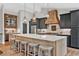 Beautiful kitchen with stainless steel appliances, a large island, and custom cabinets at 230 Thistlewood Ln, Roswell, GA 30075
