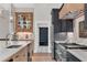 Beautiful kitchen with wooden island, marble countertops, stainless appliances, and custom range hood at 230 Thistlewood Ln, Roswell, GA 30075