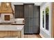Modern kitchen with custom cabinetry, stainless steel appliances, and a bright window view at 230 Thistlewood Ln, Roswell, GA 30075