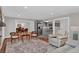 Inviting living room with fireplace and open layout to the modern kitchen and dining areas at 230 Thistlewood Ln, Roswell, GA 30075
