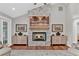 Inviting living room with a stone fireplace, hardwood floors, and elegant decor at 230 Thistlewood Ln, Roswell, GA 30075