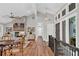 Elegant living room featuring a stone fireplace, vaulted ceilings and hardwood floors at 230 Thistlewood Ln, Roswell, GA 30075