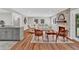 Spacious living room with stone fireplace and open layout to the modern kitchen and dining areas at 230 Thistlewood Ln, Roswell, GA 30075