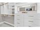 Organized walk-in closet with custom shelving and drawers for ample storage at 230 Thistlewood Ln, Roswell, GA 30075
