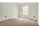 Bright bedroom features neutral carpet, light walls, and a window with blinds for a cozy space at 234 Riverstone Commons Cir, Canton, GA 30114