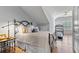 Cozy bedroom featuring a queen bed, hardwood floors, and a treadmill near a window with plantation shutters at 4486 Huffman Drive Ne Dr, Roswell, GA 30075