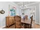 Dining room with wood table, decorative chandelier, and built in buffet at 4486 Huffman Drive Ne Dr, Roswell, GA 30075