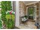 Charming home entrance with stone walkway, decorative bench, and lush landscaping at 4486 Huffman Drive Ne Dr, Roswell, GA 30075