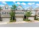 Attractive townhome with brick, two-car garage, and manicured landscaping at 4486 Huffman Drive Ne Dr, Roswell, GA 30075