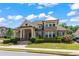 Charming two-story home featuring a covered porch, brick accents, and landscaped front yard at 4486 Huffman Drive Ne Dr, Roswell, GA 30075
