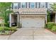 Beautiful townhome features a two-car garage, and lovely landscaping at 4486 Huffman Drive Ne Dr, Roswell, GA 30075