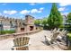 Outdoor brick fireplace and seating area near the pool, perfect for relaxation and entertainment at 4486 Huffman Drive Ne Dr, Roswell, GA 30075