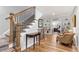 Elegant foyer with hardwood floors, staircase, and view into the main bedroom at 4486 Huffman Drive Ne Dr, Roswell, GA 30075