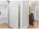 Hallway showcases an in-home elevator, hardwood floors, and elegant decor at 4486 Huffman Drive Ne Dr, Roswell, GA 30075