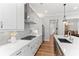 Bright kitchen with stainless steel appliances, modern countertops, and hardwood floors at 4486 Huffman Drive Ne Dr, Roswell, GA 30075