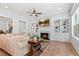 Bright living room with fireplace, custom built-ins, and beautiful hardwood floors at 4486 Huffman Drive Ne Dr, Roswell, GA 30075