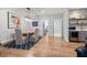 Open concept floor plan with a dining room with wet bar and a view into another room with a treadmill at 4486 Huffman Drive Ne Dr, Roswell, GA 30075